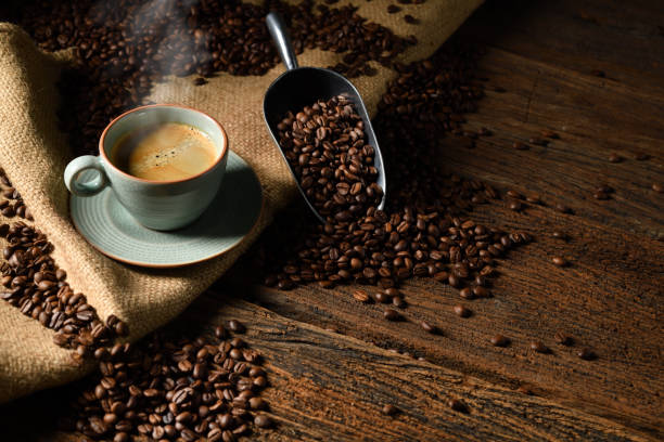 Espresso and coffee beans on a rustic table